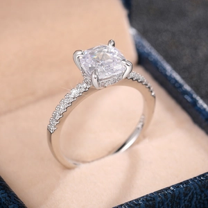 Macro shot of silver ring featuring a large square-cut zirconia and pave diamonds