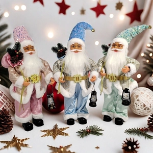 Three-piece set of Santa figurines in macaron pink, blue, and green with golden belts