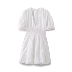White mini dress with V-neck, puff sleeves and detailed floral embroidery on clean background