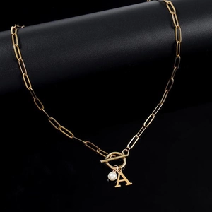 Gold paperclip chain necklace with initial A pendant, toggle clasp, and a faux pearl detail
