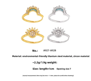 Detailed view of bohemian sun and crown rings with sparkling cubic zirconia in titanium steel