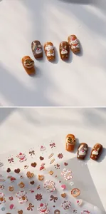 Detailed view of self-adhesive cartoon nail stickers with puppy and dessert motifs