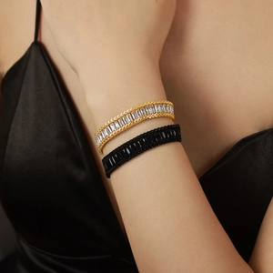 Luxe gold titanium bracelet with baguette zircon and black wheat chain jewelry