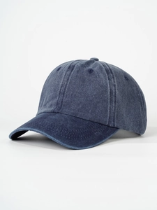 Detail view of washed navy blue cotton baseball cap showing vintage texture and stitching