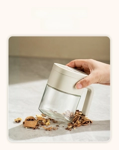 Macro shot of durable lead-free glass seasoning jar crushing a walnut to show high strength