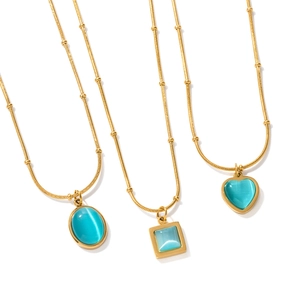 Minimalist gold necklaces with oval, square, and heart cat-eye pendants in cyan blue