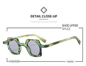 Detail of green marble texture frame and purple tinted lenses on punk sunglasses