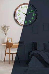 Detailed comparison of 12-inch wall clock with luminous dial in day and night settings