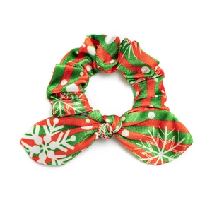 Christmas plush bunny ear scrunchie with red and green stripe pattern and snowflakes