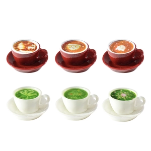 Miniature Christmas coffee cups with festive latte art patterns for dollhouse decor