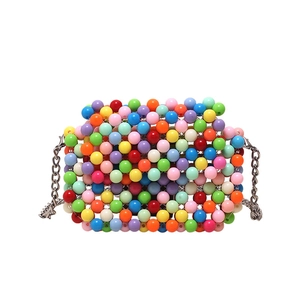 Rainbow beaded mini crossbody bag with colorful candy beads and silver chain strap