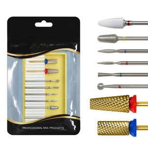 Close-up of professional ceramic and tungsten nail drill bits with color-coded bands