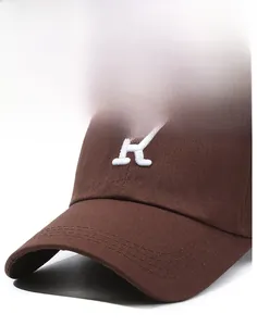 Close-up of premium dark brown cotton baseball cap featuring thick white R embroidery