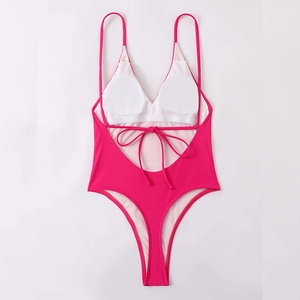 Deep V-neck one-piece swimsuit in hot pink with cross back straps and removable pads