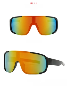 Detail of matte black cycling glasses with red orange mirrored lens and windproof frame