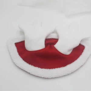 Detail of red velvet Christmas horse cloak with white fur trim and plush reindeer antlers