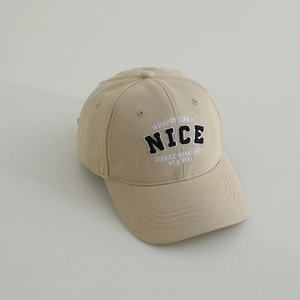 Close-up of beige cotton baseball cap featuring high-quality NICE embroidery detail