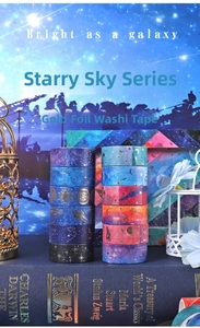 Detail of starry galaxy washi tape with gold bronzing motifs of stars and planets