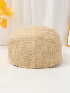 Close-up of beige breathable linen fabric texture on a vintage style flat ivy cap