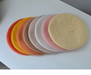 Selection of solid color wool berets in various warm autumn and winter shades