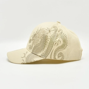 Detail of golden dragon print on beige twill cotton baseball cap for men and women