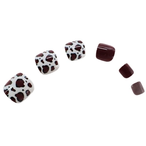 Deep burgundy and brown cow print square press-on toenails with a high-gloss finish