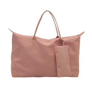 Pink waterproof nylon tote bag with matching pouch and leather trim handles