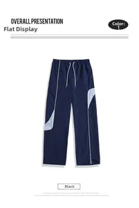 Close-up of drawstring waist and contrast side stitching on navy casual pants