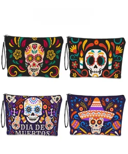 Four different Day of the Dead makeup bags with sugar skull and marigold patterns