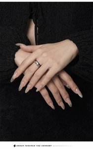 Detail of vintage oxidized silver ring with clear gemstone on a professional model