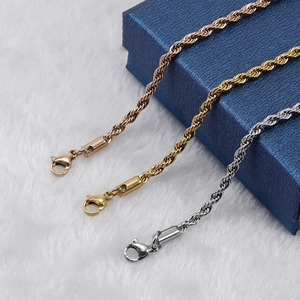 Three twisted rope necklaces in gold rose-gold and silver with blue jewelry box