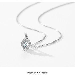 Macro shot of 925 silver marquise pendant with cubic zirconia and delicate O-chain