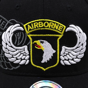 Close-up of high-density Airborne embroidery on black twill tactical baseball cap