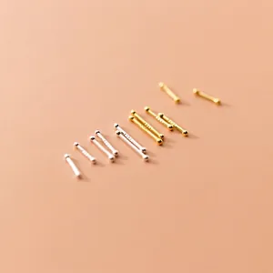 Minimalist 999 sterling silver ball stud earrings set in silver and gold finishes