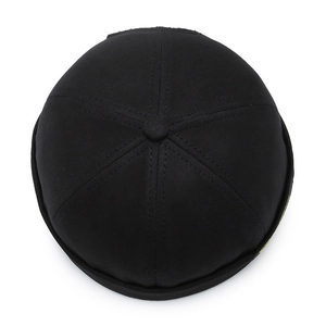 Modern black docker cap with six-panel construction and yellow side detail on white background