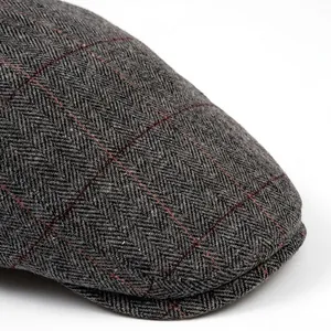 Men's deep grey herringbone flat cap with orange plaid patterns and wide brim