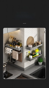 Detail view of the gray wall-mounted kitchen rack with hooks for multi-functional storage