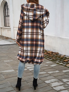 Back view of a casual hooded jacket with brown plaid pattern and color blocking detail