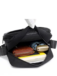Black waterproof crossbody bag with large capacity showing umbrella and wallet storage