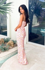 Detail of the pink floral maxi dress showing thin straps and open back design