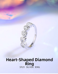 Macro side view of S925 sterling silver ring with five heart-shaped cubic zirconia stones