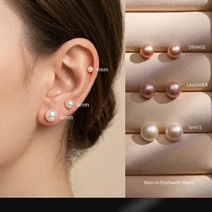 Detail of multi-size natural freshwater pearl earrings set in 999 sterling silver