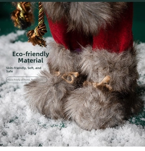Close-up of Santa Claus plush boots with gold woven cords and soft red velvet fabric