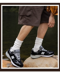 Thick white ribbed cotton crew socks for men shown in a natural outdoor hiking style