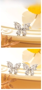 Detail view of silver butterfly stud earring with marquise-cut cubic zirconia crystals