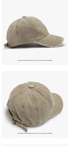 Detail of vintage washed baseball cap with distressed brim and 3D letter embroidery
