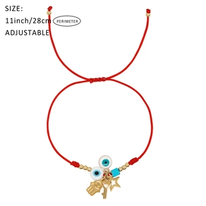 Adjustable red braided rope bracelet with golden evil eye and Hamsa hand charms