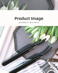 Detail showing two professional black silicone eyelash brushes with fine curved teeth