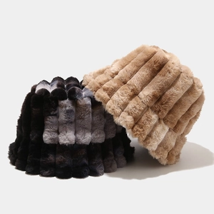 Winter faux fur bucket hats in black-grey tie-dye stripes and solid camel plush fabric