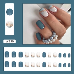 Detailed macro view of 24pc blue and white gold foil press-on nails set with SKU W330